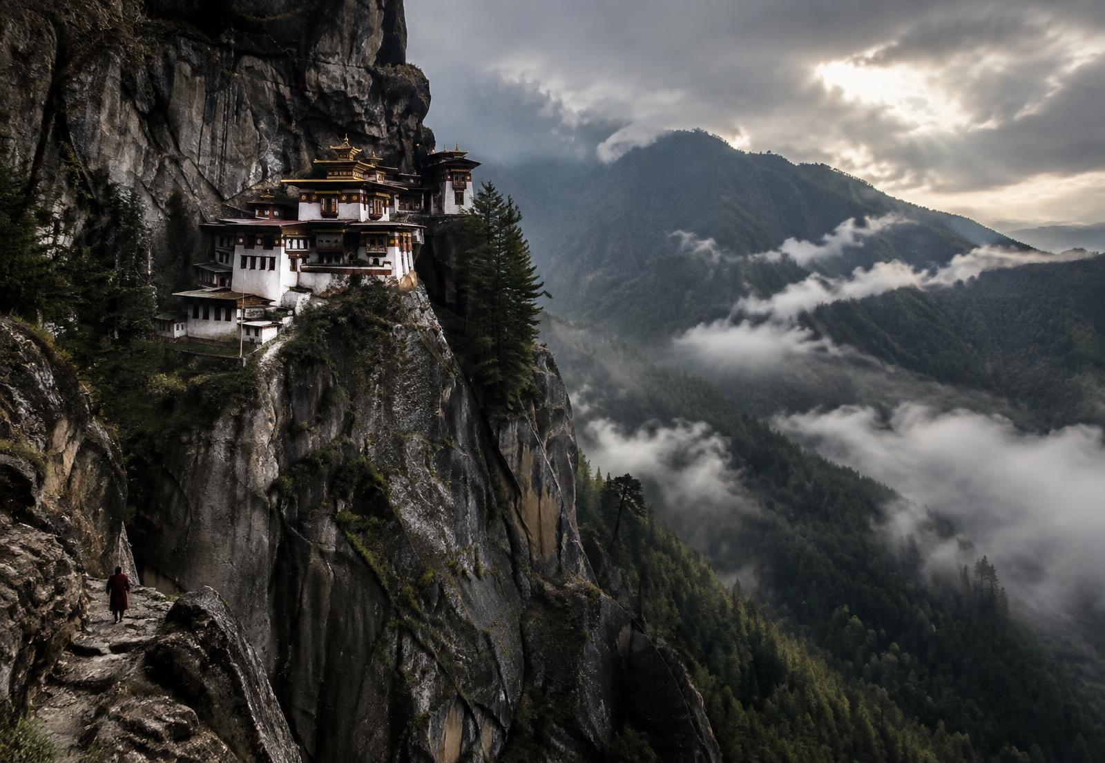 Remote monastery on a misty mountainside in Bhutan